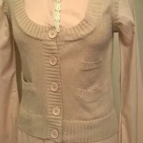 Beige shirt and vest set.
