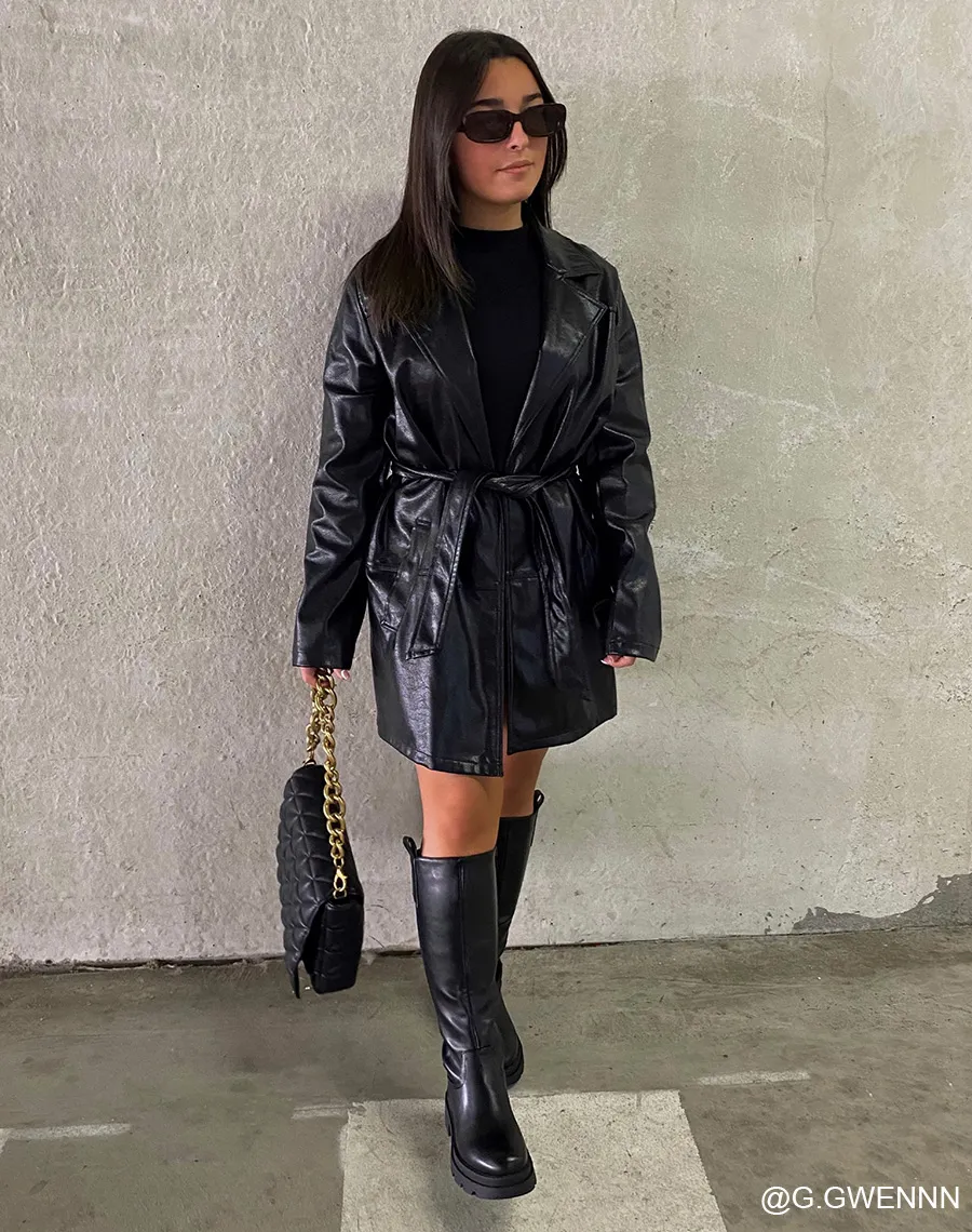 Black high boots with grooved sole.