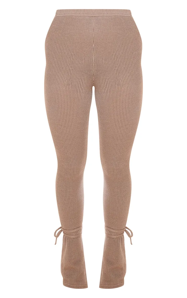 Gray stone transparent ribbed leggings with slit hem and bow detail.