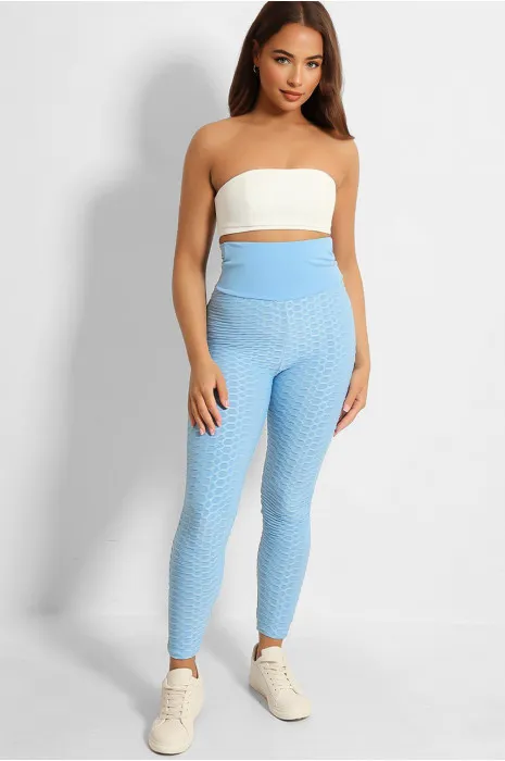 High-waisted turquoise anti-cellulite slimming push-up leggings with back bow.