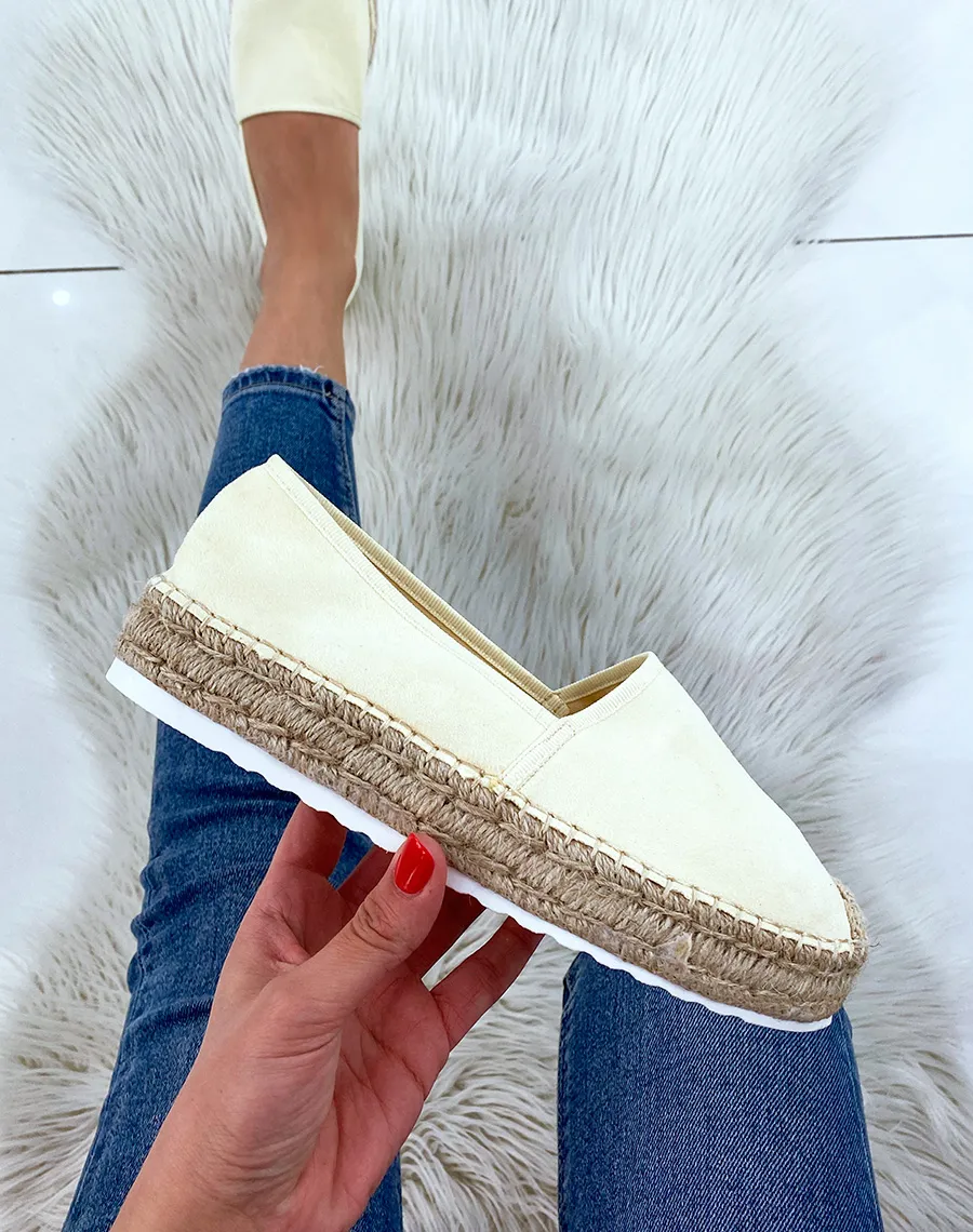 Pastel yellow jute and suede espadrilles.