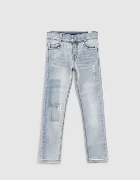 Slim fit organic cotton faded blue jeans for boys waterless technique.